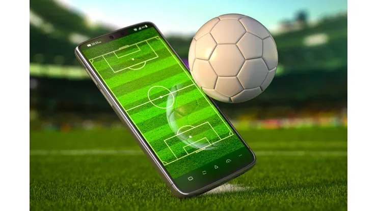 Mobile phone and soccer ball. Football app video game on smartphone and betting online concept. Mobile phone and soccer ball. Football app video game on smartphone and betting sport online concept. 3d illustration LicenseRF 20577687 Copyright: xZoonar.com/MaksymxYemelyanovx 20577687